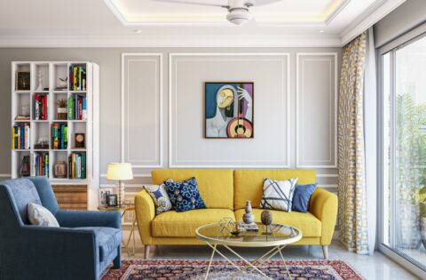 Bright living room showing a balanced west-facing house Vastu design with warm evening light.