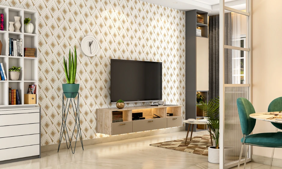 Modern compact living room design with geometric wallpaper, floating wood TV unit, and glass partition for a 2BHK.