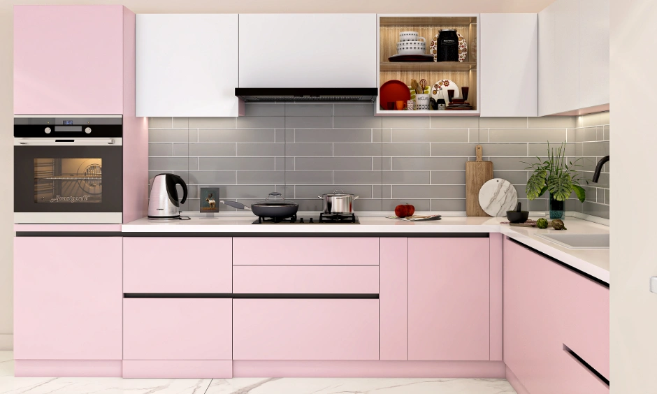 Contemporary kitchen design storage featuring handleless pink drawers and built-in appliance unit.