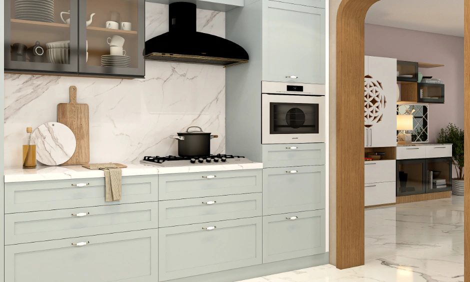 Close-up of a matte kitchen design with grey framed shutters and refined slim-profile metal hardware.