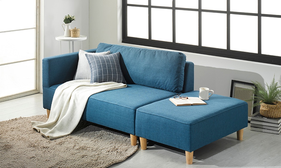 Floating sofa in a compact living room creates depth and makes the space feel larger.
