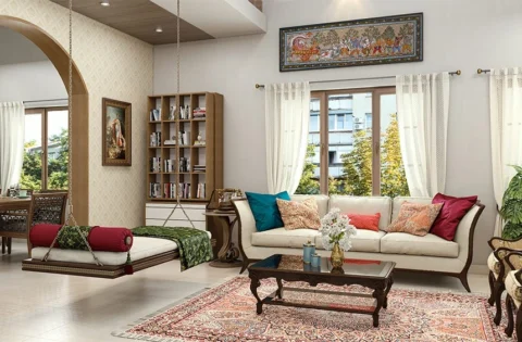 Kerala style interior design featuring a classic wooden swing and airy traditional layout.