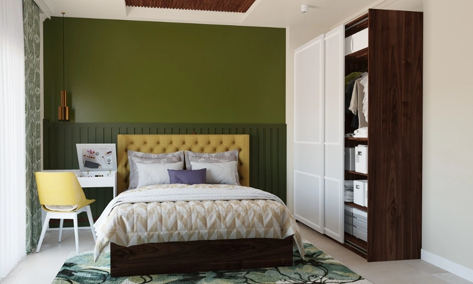 Olive green wall with mocha brown furniture creates a neutral and well-balanced interior.