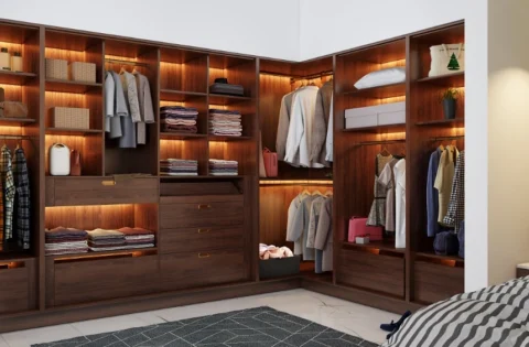 An L-shaped wardrobe design uses bedroom corners efficiently to maximise storage and maintain open space.
