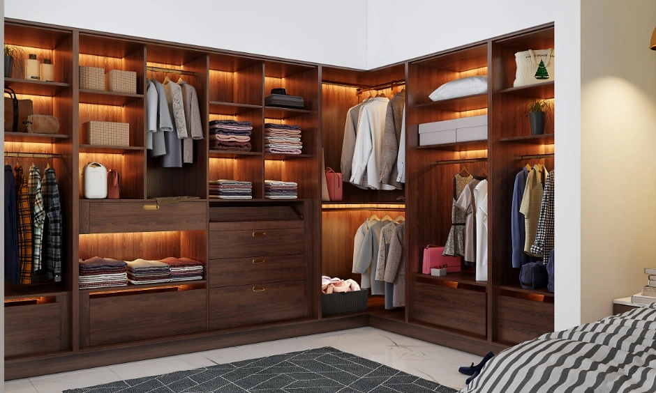 An L-shaped wardrobe design uses bedroom corners efficiently to maximise storage and maintain open space.