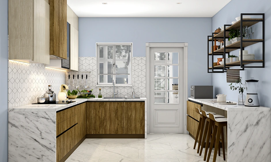 Modern island kitchen with marble countertop, breakfast counter and wooden cabinetry in an Indian apartment.