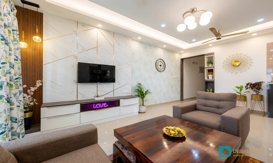 Sleek TV unit against classy wall panelling with integrated storage drawers for a modern living room.