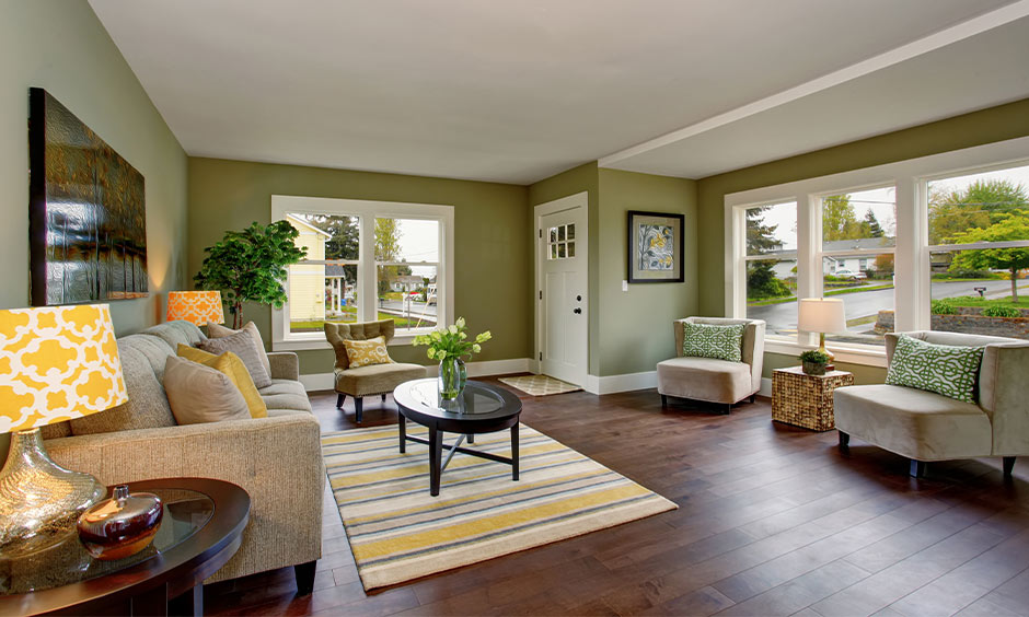 Off-white and olive green colour combination living room featuring wooden finishes and accents
