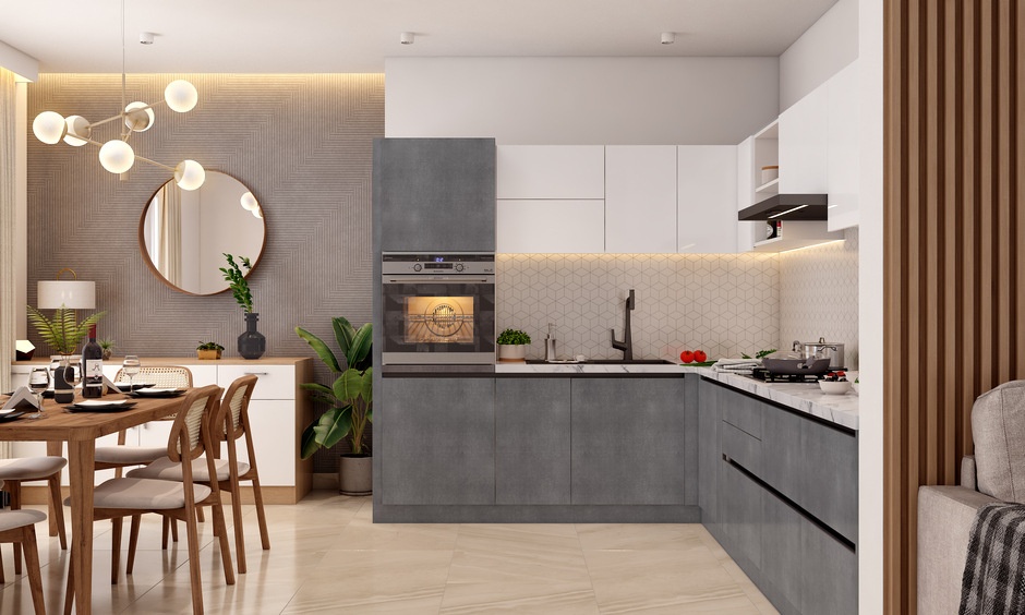 Modern L-shaped kitchen in Kolkata with grey and white cabinets, built-in oven, and patterned backsplash.