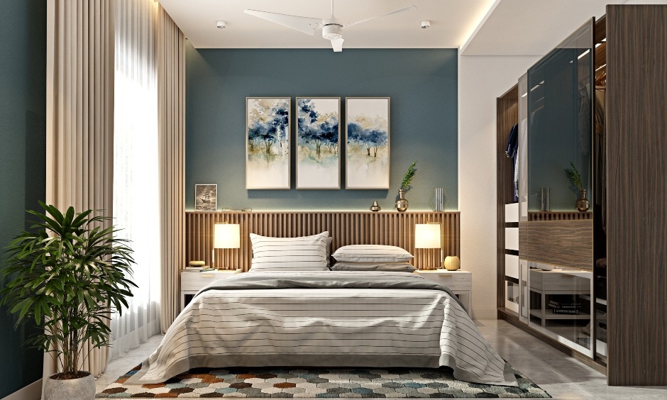 Bed separated from kitchen and pooja room walls to maintain calm and balanced bedroom energy