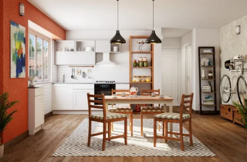 Bright modular kitchen with a cosy dining setup designed for a modern Pune home.