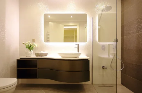 Sleek wall-mounted bathroom cabinet with curved storage for a spacious modern bathroom.