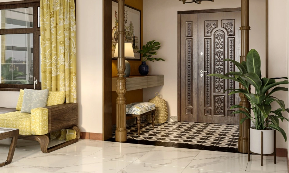 Entryway with patterned flooring, treated wooden door, indoor plants and climate-suitable materials for humid climate India homes.