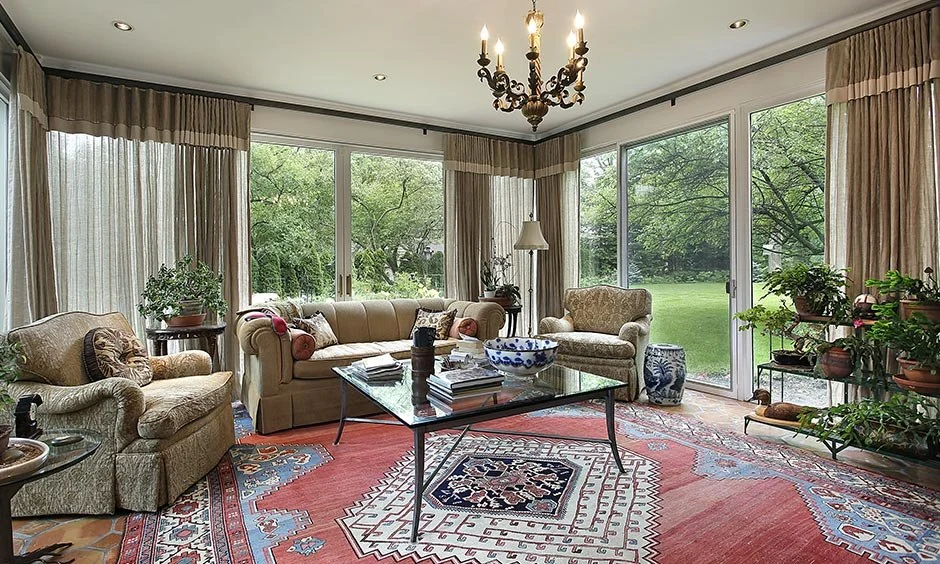 An area rug discreetly hides floor cables while maintaining a tidy living room.