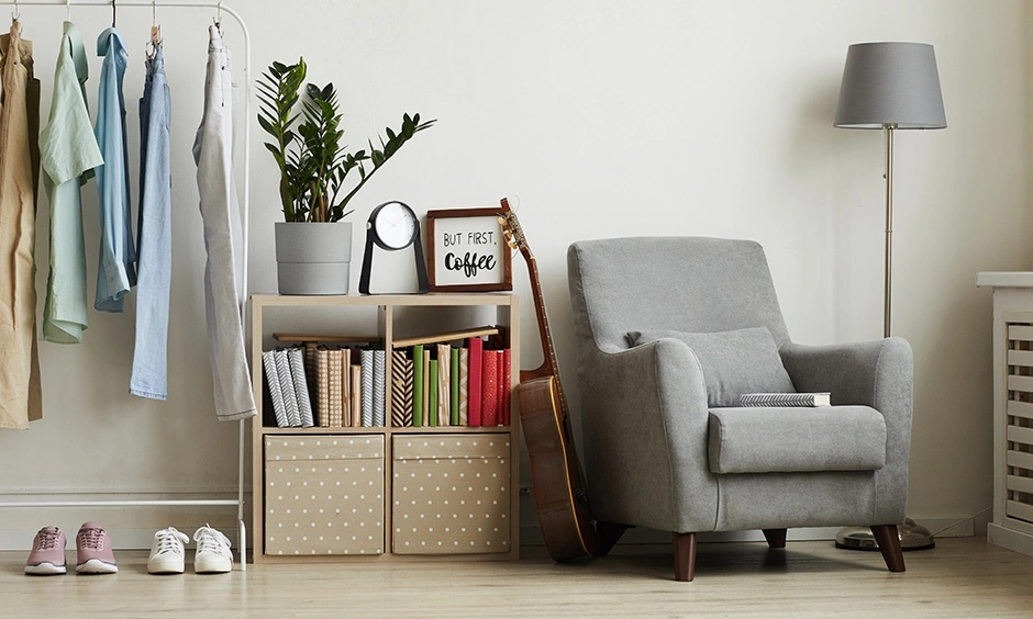 A grey recliner supports posture and creates a relaxing reading corner.