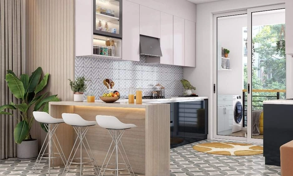 A modular kitchen design in Delhi featuring a chevron-patterned backsplash for a modern touch
