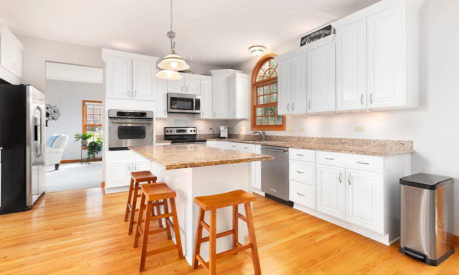 Spacious kitchen island design offering additional seating and prep space compared to a peninsula