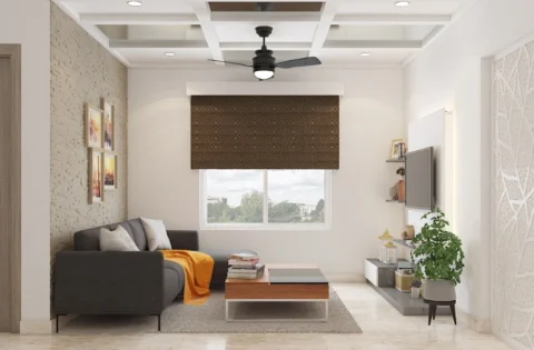 Sleek false ceiling design makes a small living room appear taller and more spacious.