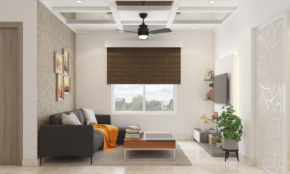 Sleek false ceiling design makes a small living room appear taller and more spacious.