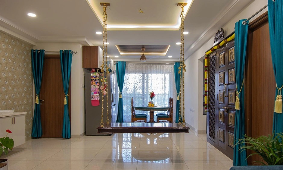 Living room featuring teak wood furniture, patterned wallpaper and warm yellow accents
