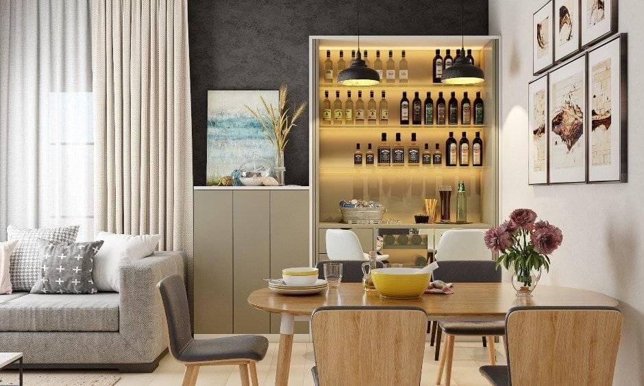 Strategic placement of low-profile bar cabinetry keeping an adjacent dining table area open and highly functional.