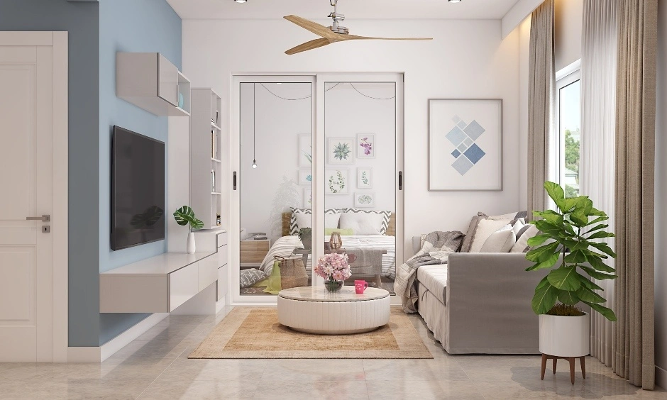 Round centre table for living room in a compact apartment with soft pastel accents