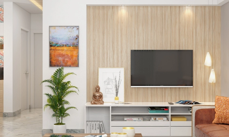 Compact living room with a TV unit, wall panelling and integrated storage solutions.