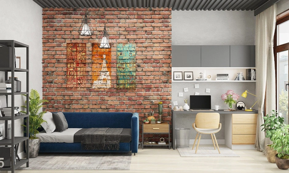 Black ceiling beams and exposed brick walls create a durable industrial-inspired bedroom.