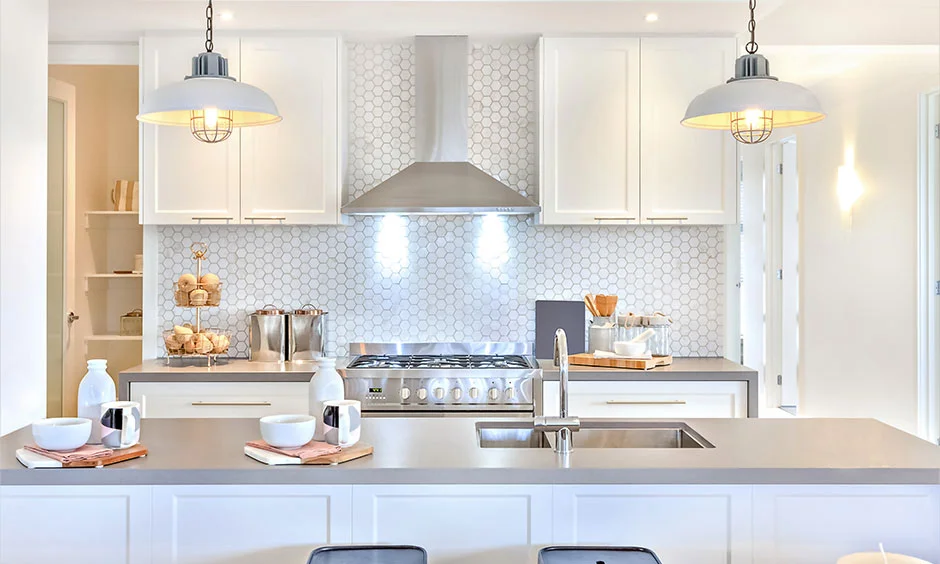 Bright cool lighting improves visibility and highlights clean lines in a modern kitchen.