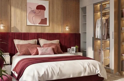 Burgundy and wood interior design colour theme for a luxurious bedroom with an upholstered bed and wardrobe