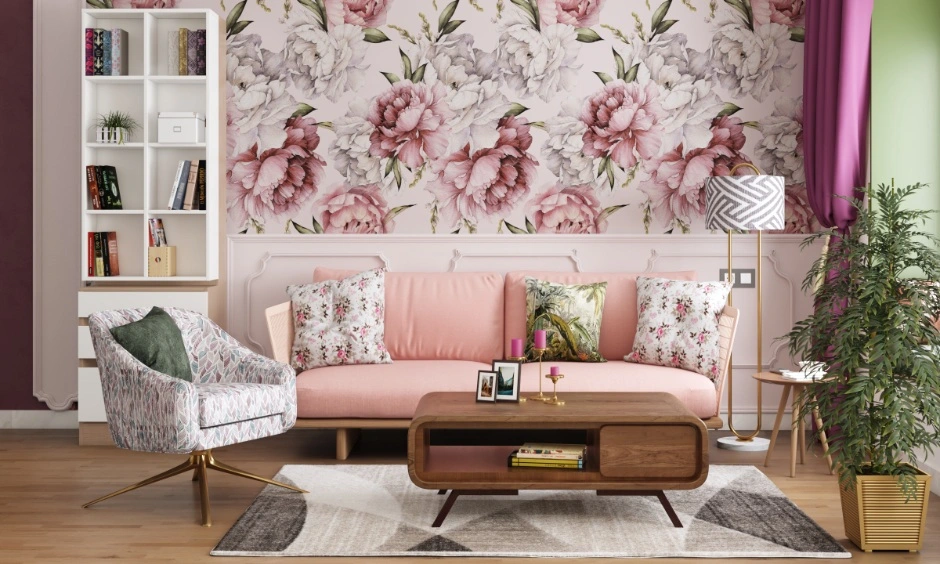 Large floral wallpaper complements blush furnishings and softens the living room palette.