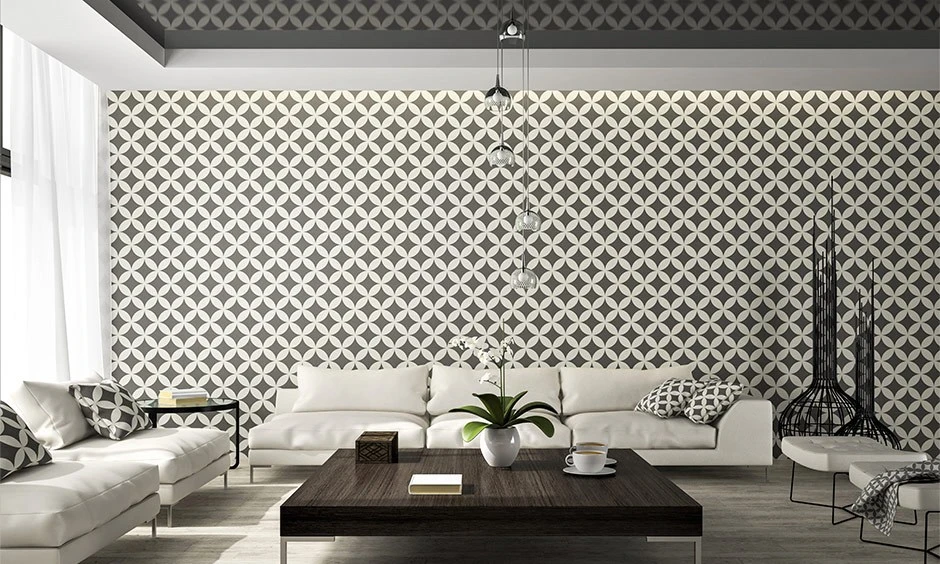 Geometric wallpaper reinforces the clean lines and simplicity of this minimalist living room