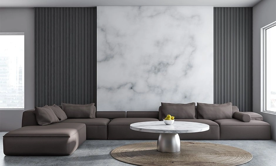Marble texture wallpaper behind an Italian sofa expanding a modern living room space.