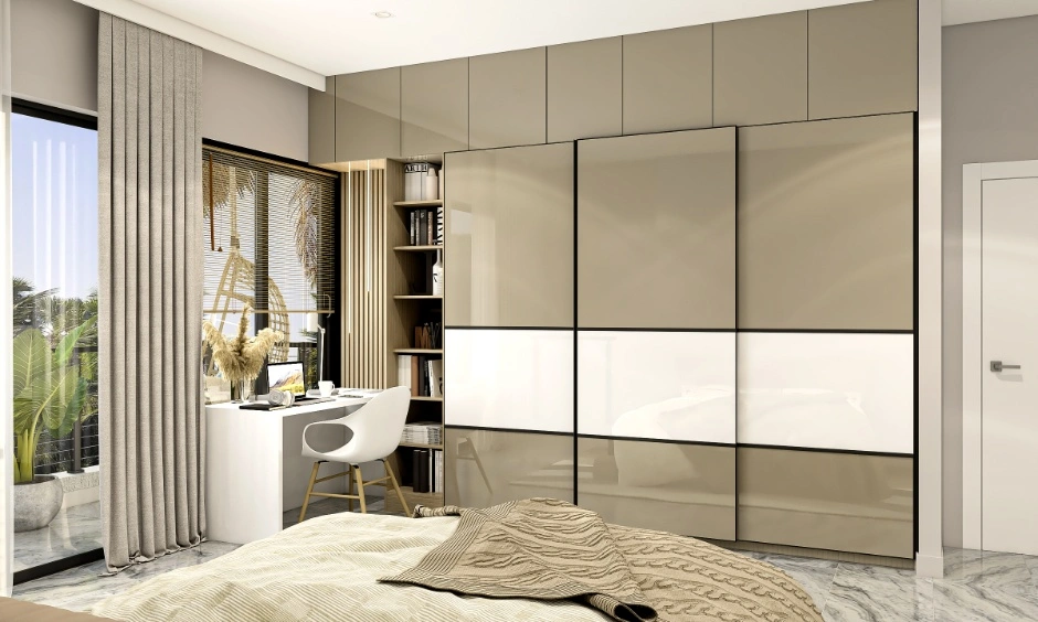 Dual-tone glossy wardrobe combines contrasting finishes to create visual balance.