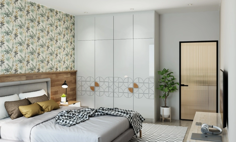 Reflective white wardrobe brightens the room while complementing patterned wall finishes.