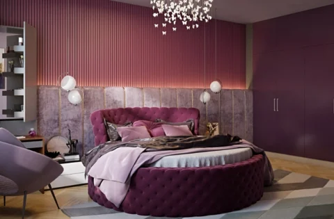 Rich plum walls and layered textures create a luxurious and inviting bedroom retreat.