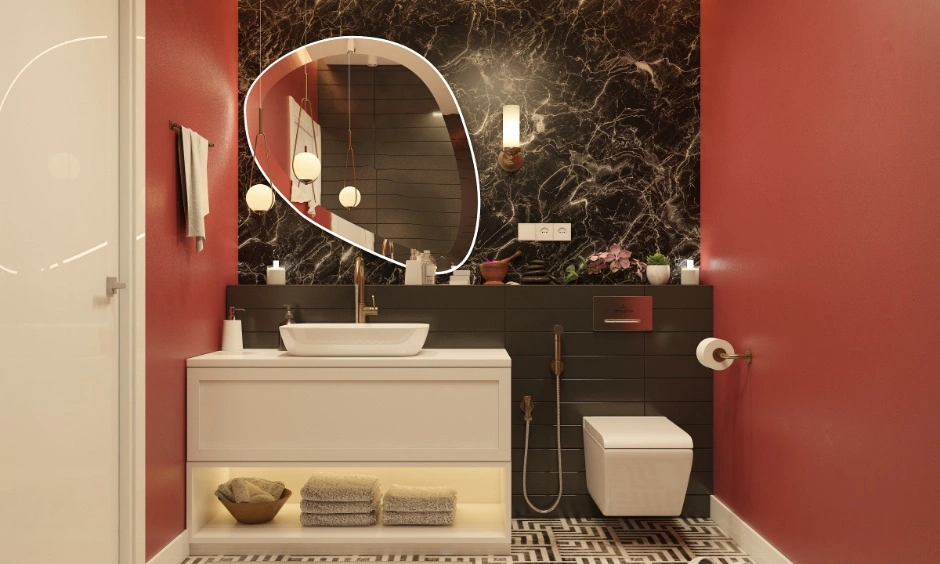 Bold red walls and black marble surfaces are balanced to prevent visual heaviness.