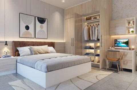 Warm oak joinery anchors the sleep and work zones in an integrated kids wardrobe with study table setup.