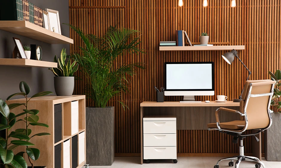 Modern home office workspace with clean slatted wood cladding unifying the wall plane and integrated storage zone.