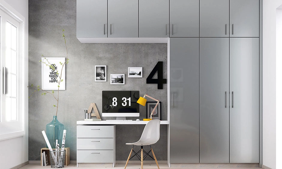 A functional home office wardrobe and workstation setup merging cleanly into one flush, floor-to-ceiling plane.