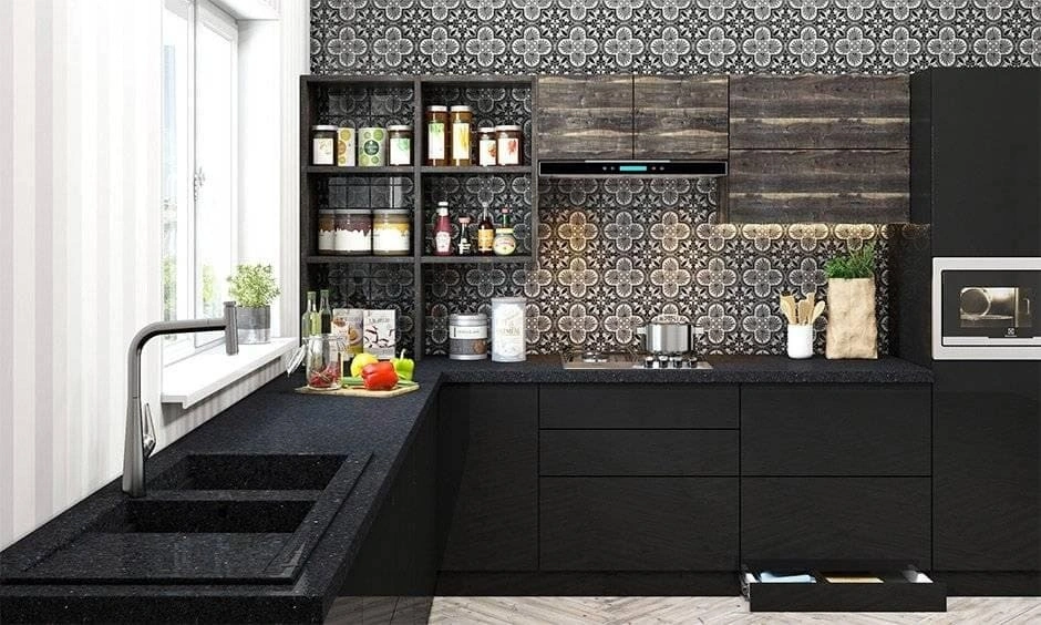 All-black kitchen featuring an under-sink storage cabinet planned around the sink area