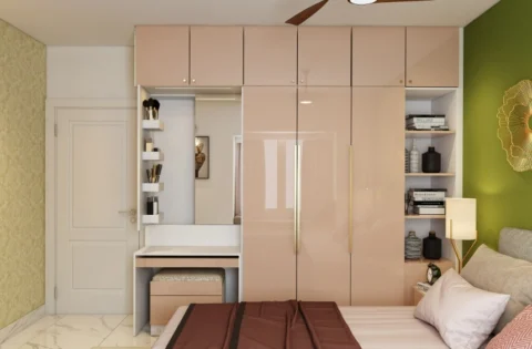Gloss laminated pink modular wardrobe with a built-in vanity and bookcase.
