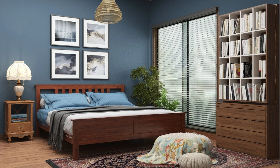Bedroom design trends Visakhapatnam with blue walls, a wooden bed and a bookshelf