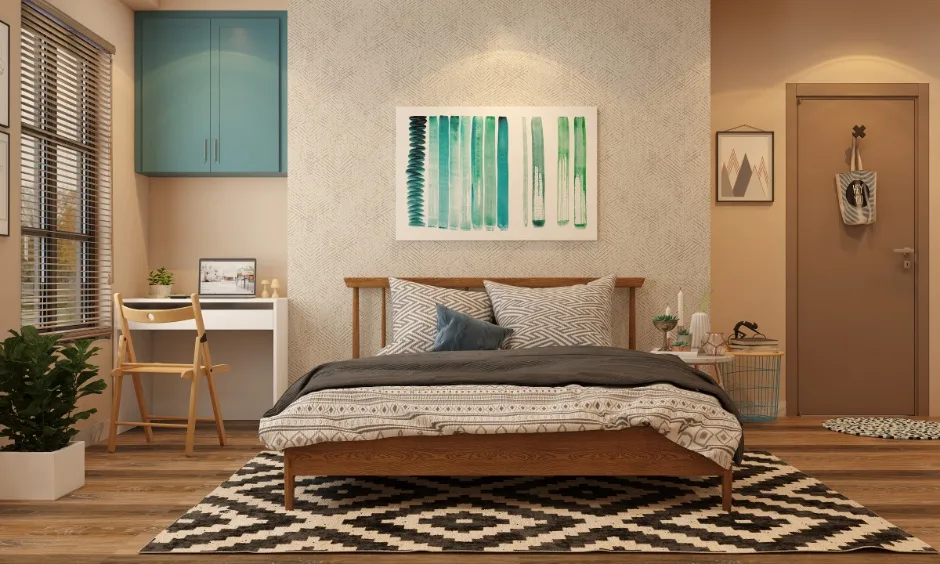 Modern bedroom design Vizag with warm tones, a wooden bed and a compact study corner