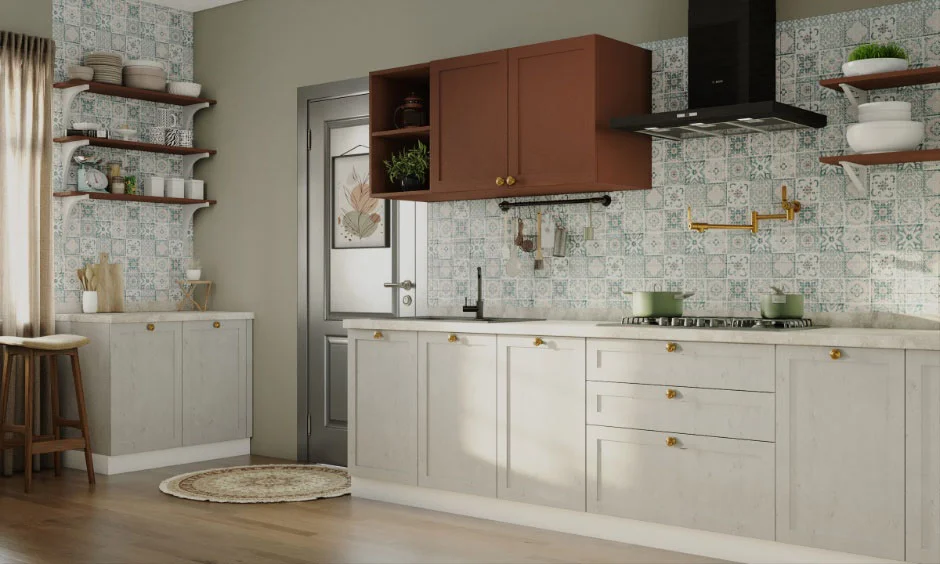 Grey base kitchen cabinet with golden knobs, which is a timeless pairing