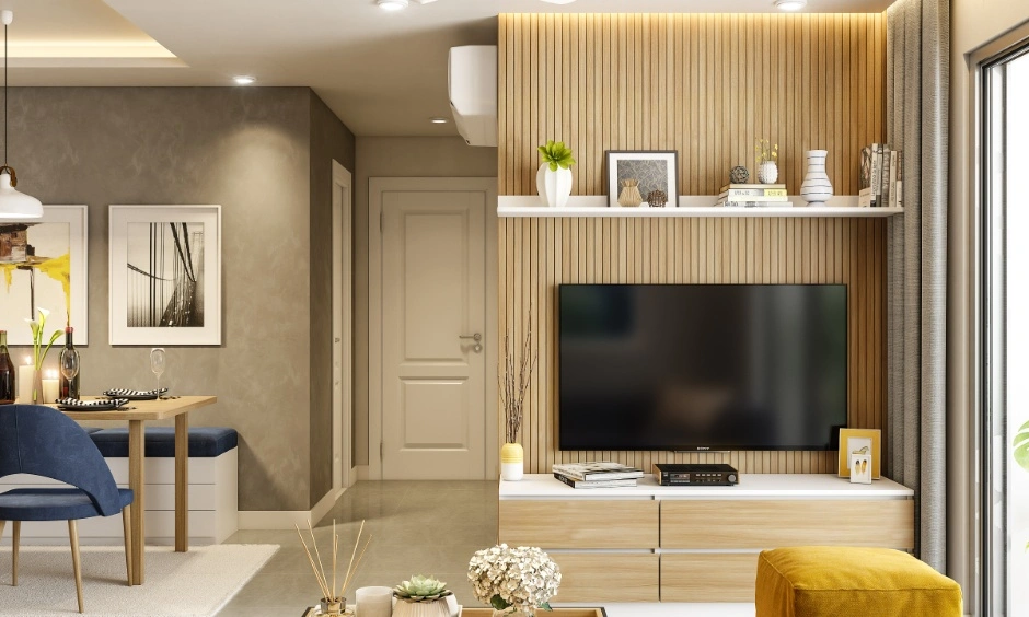 Fluted wall panelling and TV unit create a refined focal wall with warm lighting