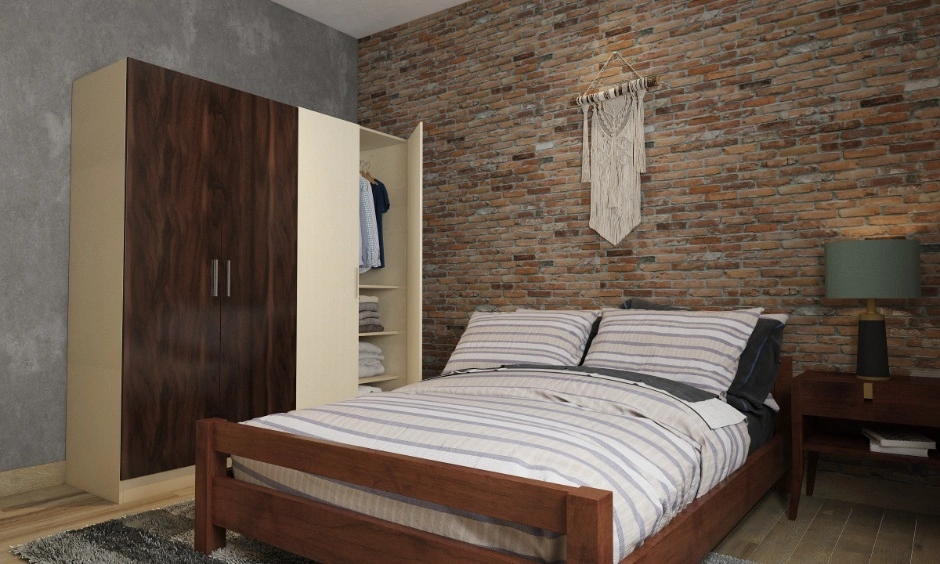 Gurgaon bedroom with an exposed brick statement wall, wooden bed and two-tone wardrobe. 