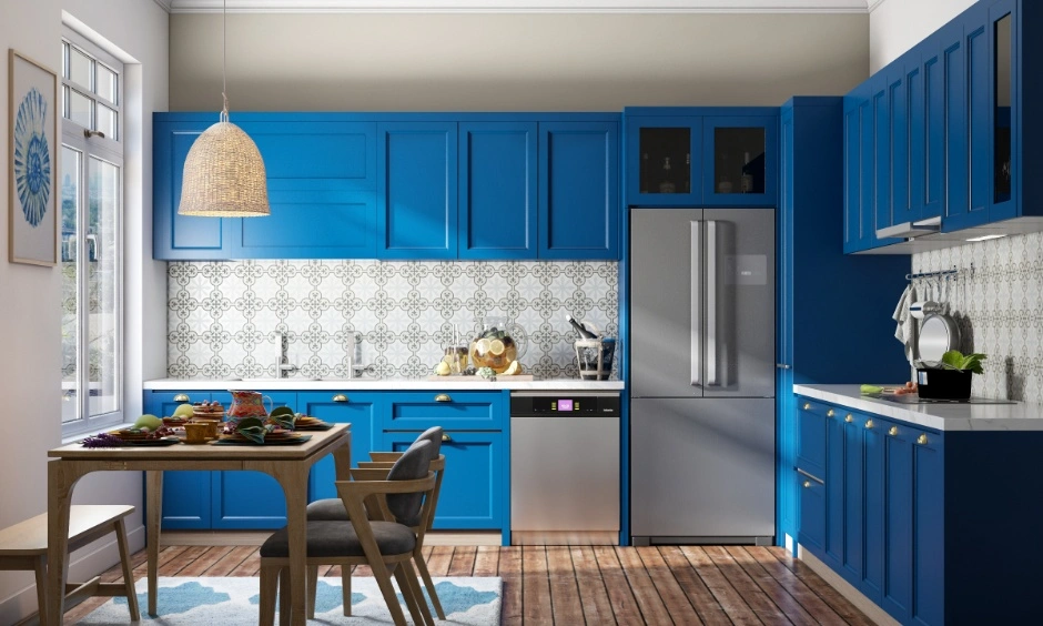 A blue kitchen with the cooking area positioned for a south-east-facing hob follows Vastu guidance.