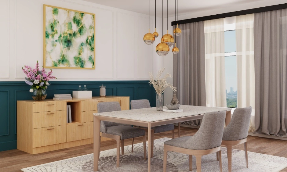 A dining room features peacock green panelling and elegant brass pendant lights.