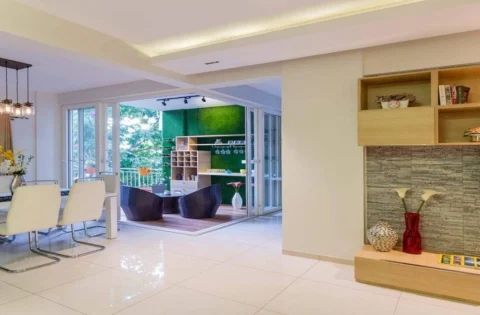 A living room features a TV unit, dining area and outdoor space within easy reach.